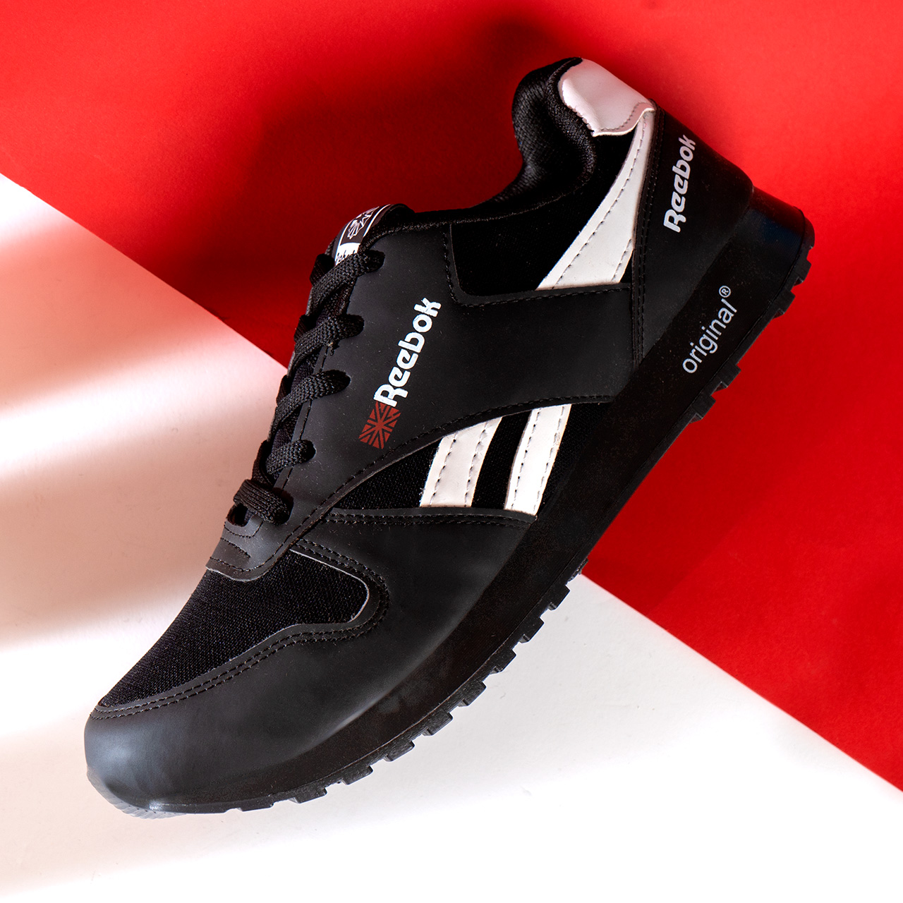 کفش ورزشی Reebok مشکی سفید مردانه مدلRako